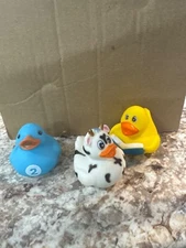 rinco ducks , a cow , blue #2 and yellow duck with a book