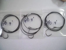 (3)  FISHING LEADERS  5/0,6/0,7/0 CIRCLE HOOKS AND 4' OF VINYL COATED WIRE ROPE