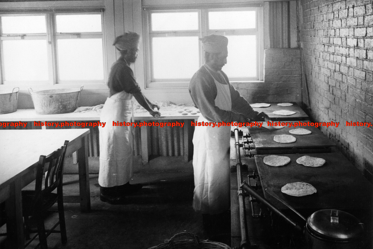 F006776 die Sikh Küche Drehen Chappaties auf den Gasherden Brighton