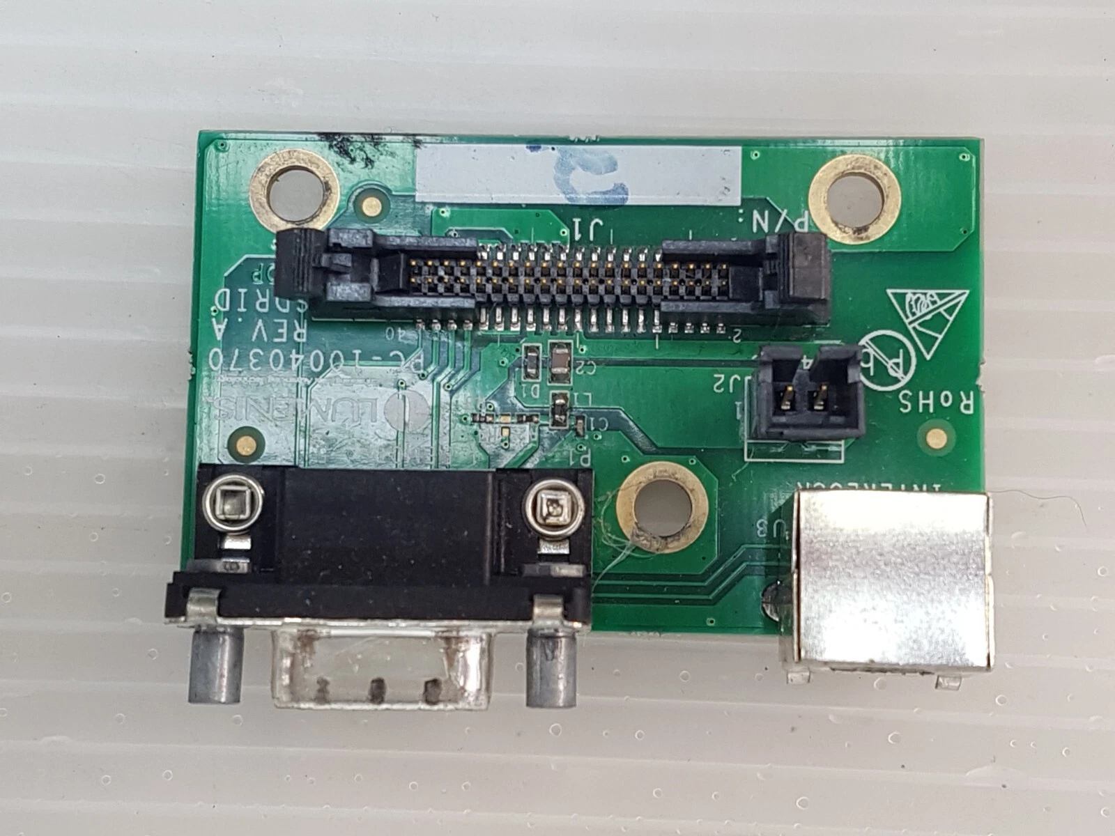 Top view of the Lumenis PC-10040370 board, rotated, showing J1, J2 and the D-sub connector