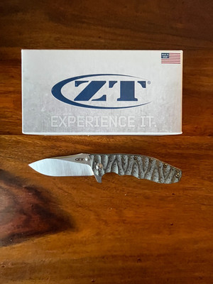 Zero Tolerance 0562CF Hinderer CPM 20CV Steel - Custom Sculpted Black Micarta