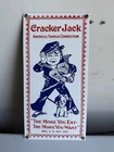 Vintage Ande Rooney Cracker Jack Advertisement Porcelain Enameled Sign 12x6 USA