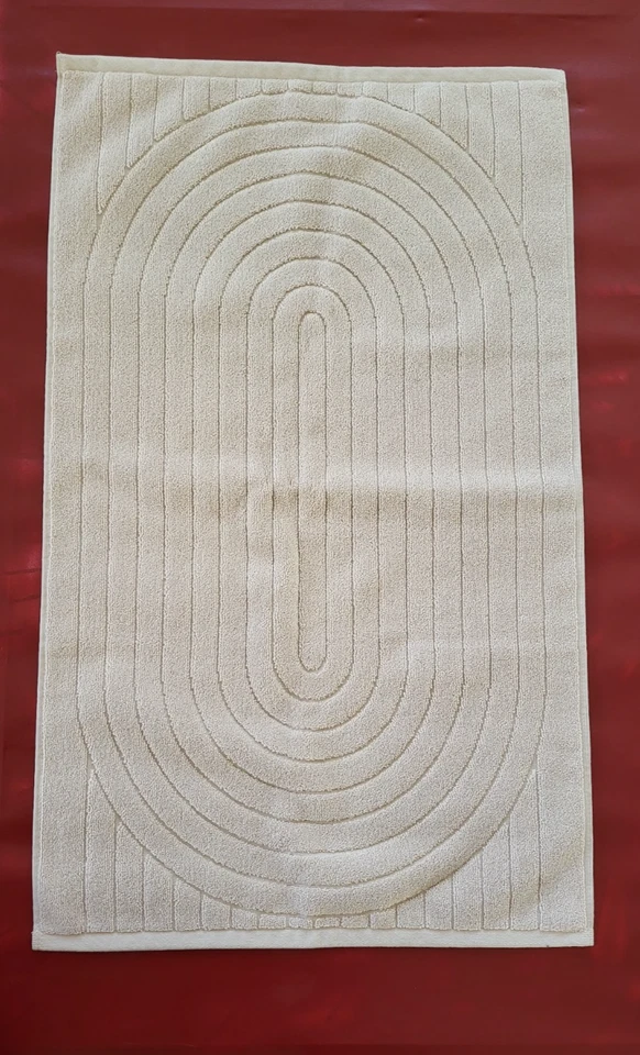 BAINA Martha Badematte aus 100% Bio-Baumwolle in Ton. Größe 19" x 31"