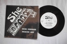 SHE NEVER SURRENDER NEAT RECORDS UK 7" VINYL SINGLE in PICTURE SLEEVE  - NWOBHM