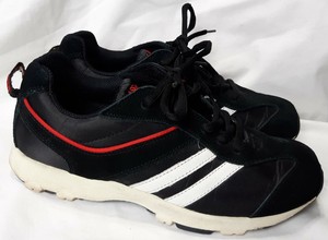 white tennis shoes with black stripes