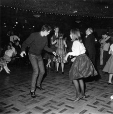 Joshua MacMillan and Polly Williams doing the twist at a dance Old Photo