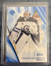 2023-24 UD Ultimate Collection #12 Connor Hellebuyck /99 Blue Winnipeg Jets