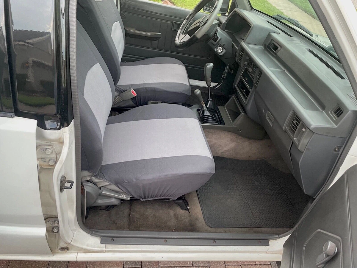 1993 Mitsubishi L200 cabin with bucket seats - view from passenger side