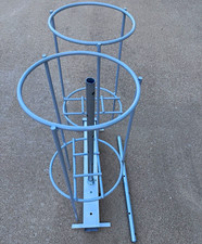 Two Gray Metal Round cylinder Stands for drying tank scuba diving tanks