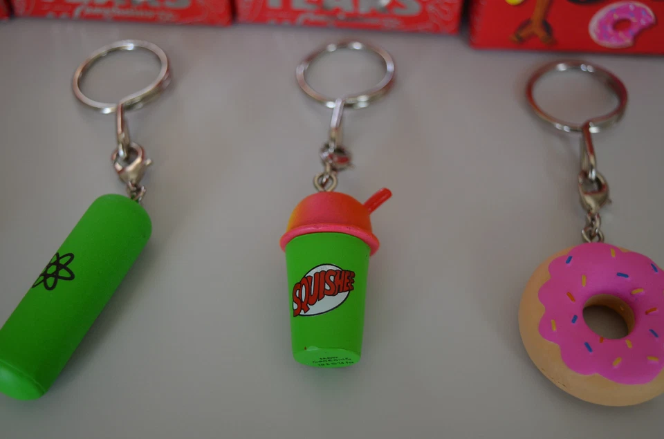 (4 Pack) The Simpsons: 25th Anniversary Keychains - Donut, Squishee, Skateboard - Image 3 of 4