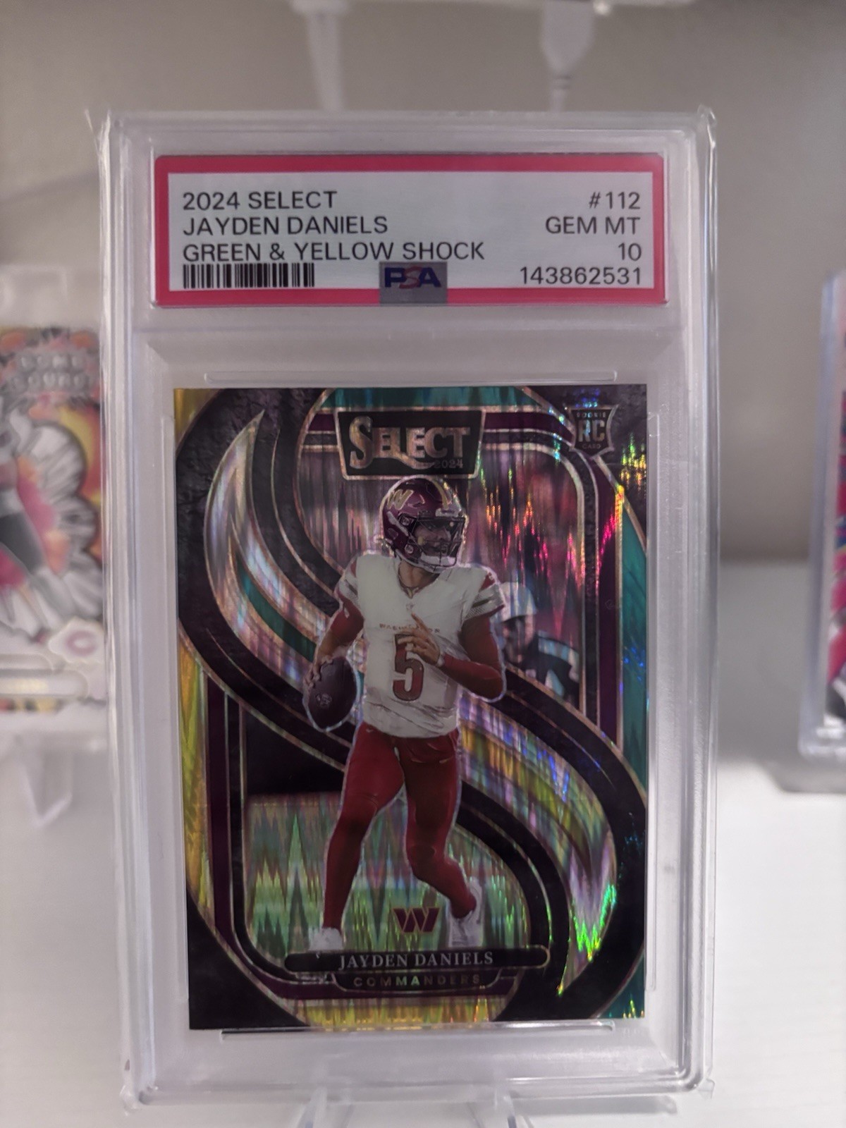 2024 Panini Select - Jayden Daniels #112 Green & Yellow Shock Prizm (RC) PSA 10
