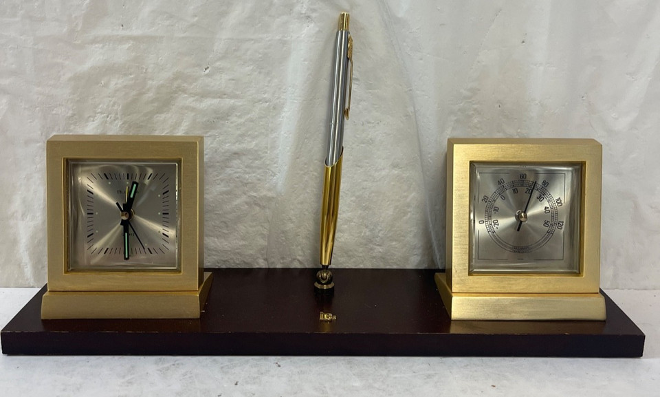 A working Bulova desk set with alarm clock, thermometer, and pen in wood and brass — mid-century executive vibes in one tested, functional package.