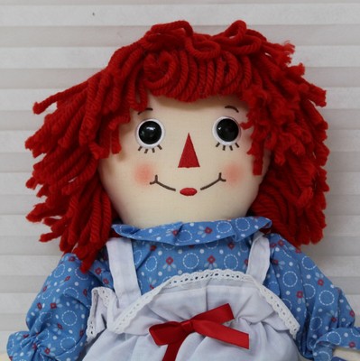 red haired doll with a triangle nose