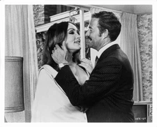 Dan Rowan thinks he has scored a victory by getting Julie Newmar t- Old Photo