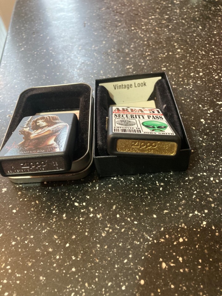 2x zippo lighters. Kit Rae/Area 51 both never seen fuel/unused eBay