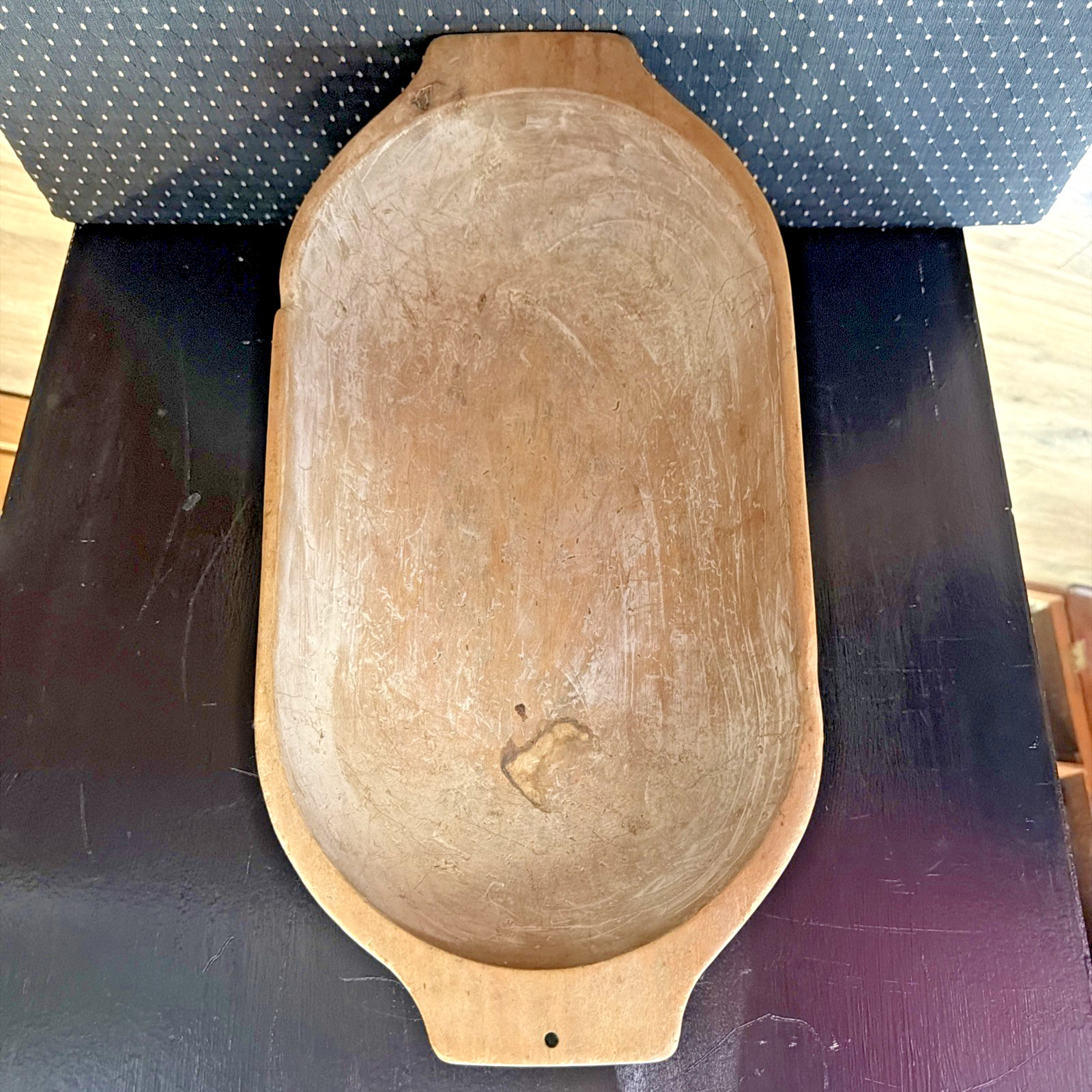 Large antique primitive hand-carved wooden dough bowl, oval trencher shape, worn natural finish.
