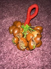 African Togus seed shaker instrument with rope handle