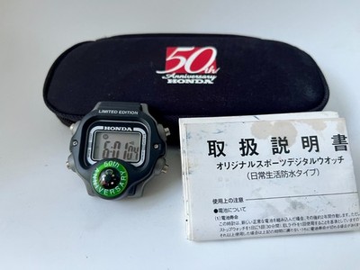 Honda 50th Anniversary Digitaluhr mit Gehäuse und Anleitung