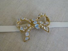 Bracciale Les Nereides in pelle bianca con fiocco dorato e cristalli bianchi