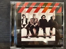 U2 • How To Dismantle An Atomic Bomb CD/DVD + 2 Singles • All Because Sometimes