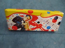 Vintage trumpet player  dancer noisemaker/rattle by Metal Toy Co.