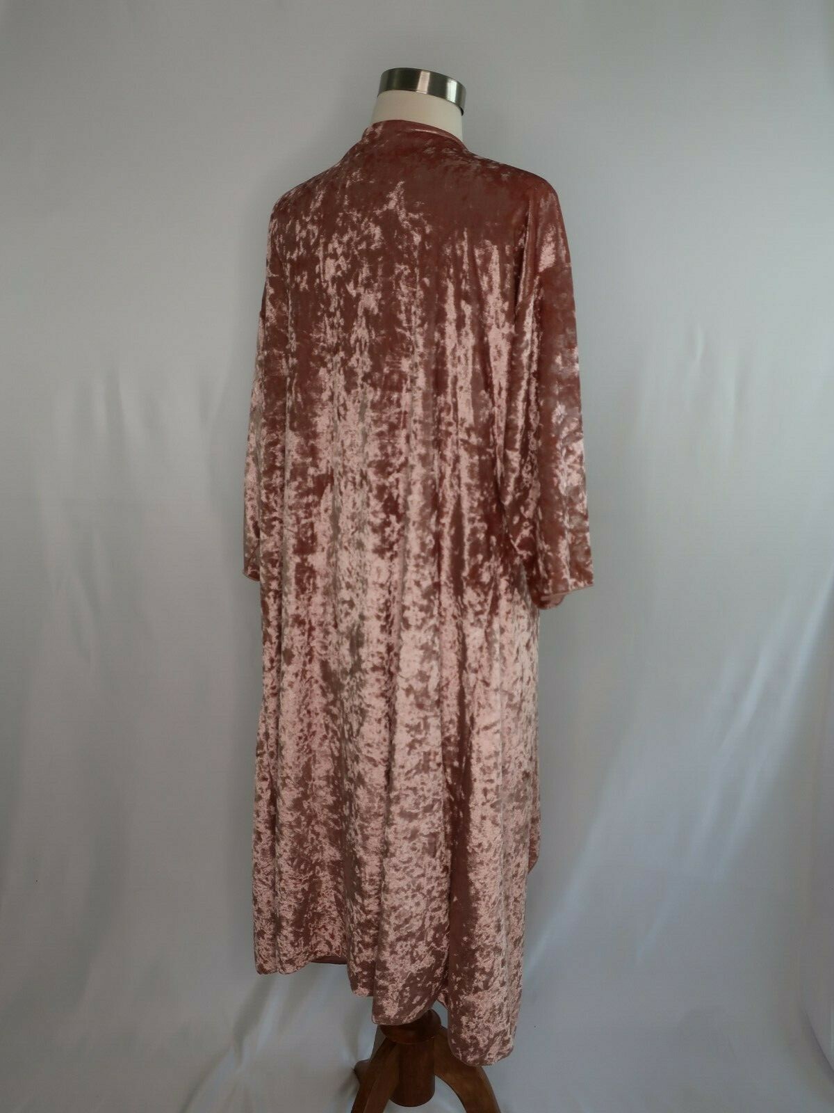 Rose gold pink velvet cover up jacket with long sleeves and back, displayed on mannequin against plain white background.