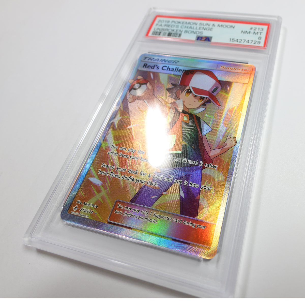 red's challenge pokemon card 213/214 PSA 9 Graded (Unbroken Bonds) proof acrylic case and featuring a striking image of the captivating character Red's Challenge (Full Art) 213/214