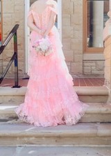Long, pink prom dress or any occasion dress. Corset back can fit from a 0-4
