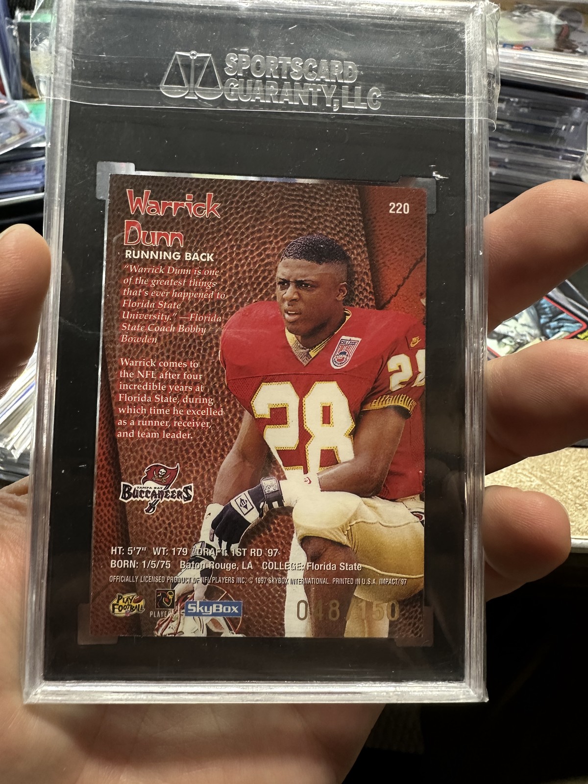 1997 SkyBox Impact Rave #220 Warrick Dunn RC #/150 SGC 9.5