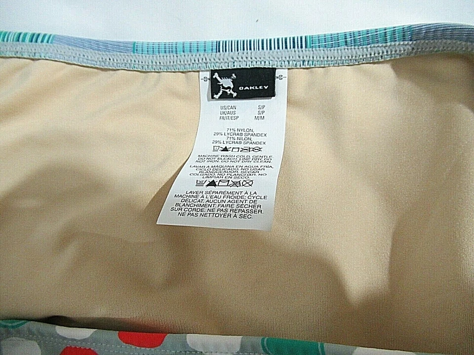 Parte inferior de bikini Oakley gris circular para mujer natación calce medio pequeño pequeño Foto 3 de 3