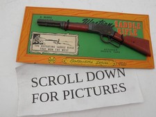 A MARX MINIATURE WESTERN SADDLE RIFLE ON CARD