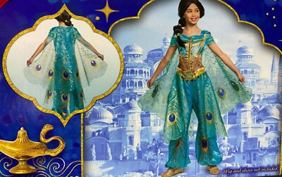 princess polly baby blue dress Naomi Scott dresses as every Aladdin character for the live-action press  tour