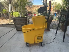 Rubbermaid Commercial Products WaveBrake 26Qt. Yellow Plastic Bucket Alloy Steel