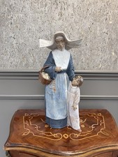 Lladro porcelain figure of a nun with a small child, No L212, 16" high