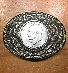 CLASSIC FLORAL SILVER TONE BELT BUCKLE WITH A LIBERTY EISENHOWER ONE DOLLAR COIN
