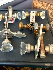 These antique glass and brass crystal door kn...