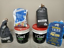 Assorted leftover iClad, iSkim render grout home building construction material