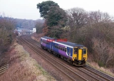 PHOTO  CLASS 156  DIESEL UNIT 156486 APPROACHES FARLAM ROAD WITH THE 14.24 PASSE