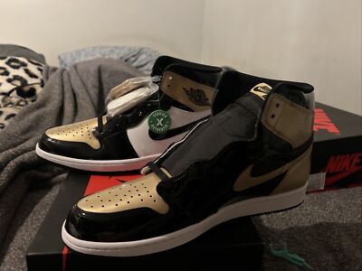 stock x jordan 1 black and gold