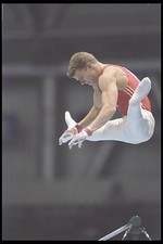 Raphael Wey of Switzerland jumps to the next bar World Gymnastics - 1995 Photo