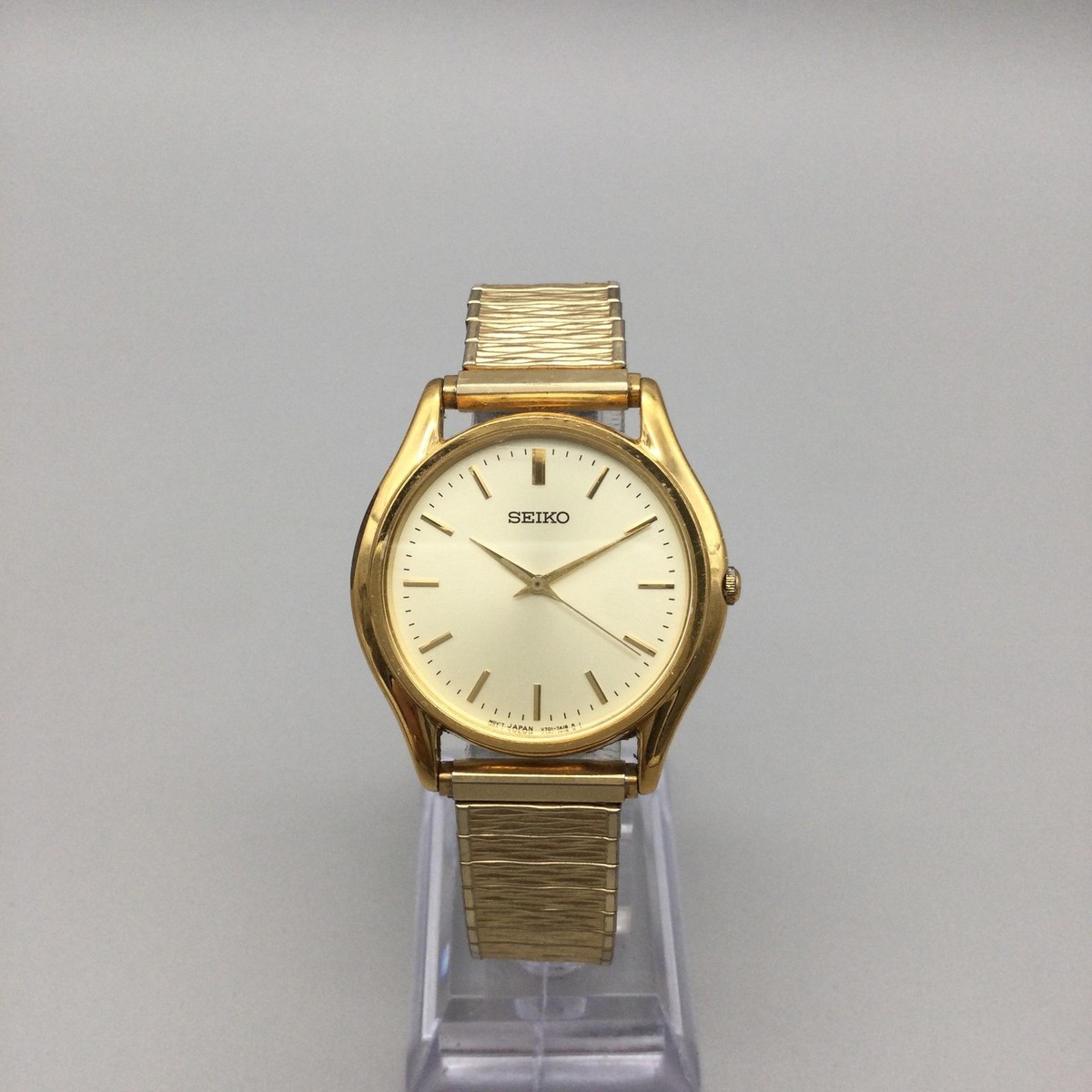 Vintage Seiko Mens Watch 34mm Gold Tone Stretch Band V701-7A29 New