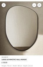 Large irregular shaped mirror with a black metal frame-Zara Home