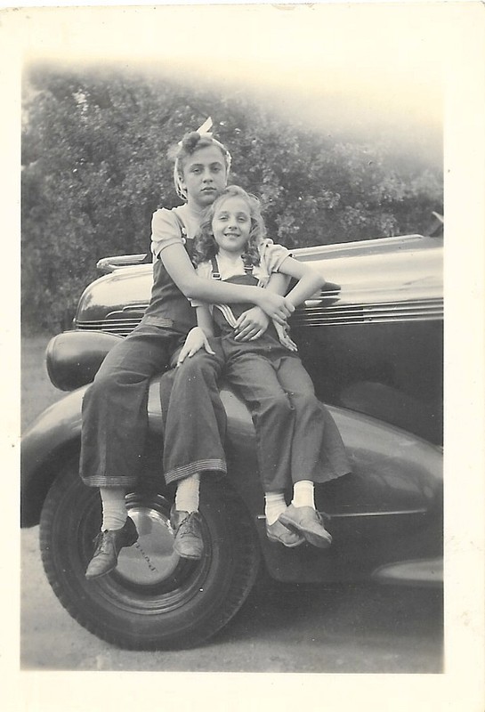 vintage photo girls sitting on antique Pontiac car fender