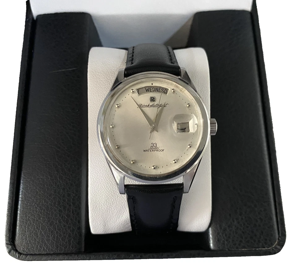 Montre vintage Ricoh Day-Date cadran argenté 33 bijoux en acier inoxydable Japon - Photo 1/4