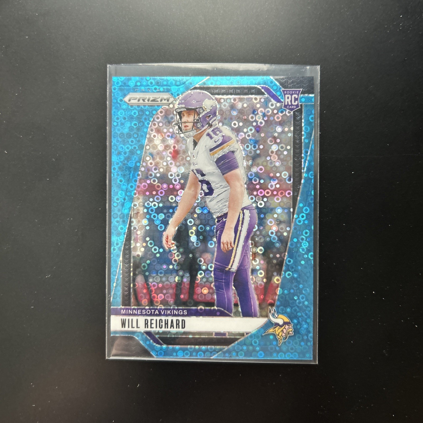 2024 Panini Prizm Rookies Will Reichard Blue No Huddle Prizm /99 (RC) Vikings