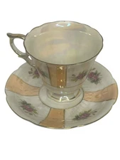 Vintage Porcelain Teacup and Saucer Set with Gold Accents Floral Design