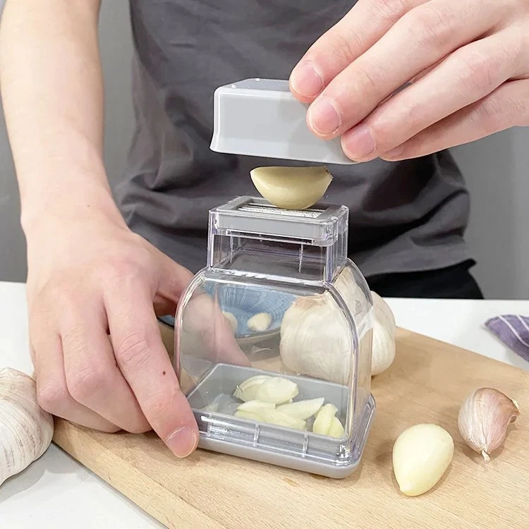 Manual Garlic Press Crusher Grinder Mincer Kitchen Tool Peeler.
Opens in a new window or tab