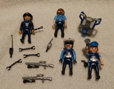lot pièces  Playmobil personnage policier arme menotte gyropode carabine talkie - Photo 1/2