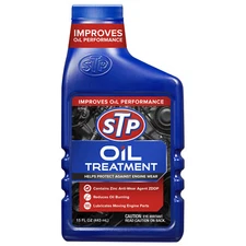 STP OIL TREATMENT Protect Against Engine Wear REDUCES OIL BURNING Lubricates Mov