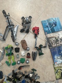 Lego Lot 2lbs 4oz of BIONICLE Masks Weapons, Parts. 8570,8571, 8618,8746,8566